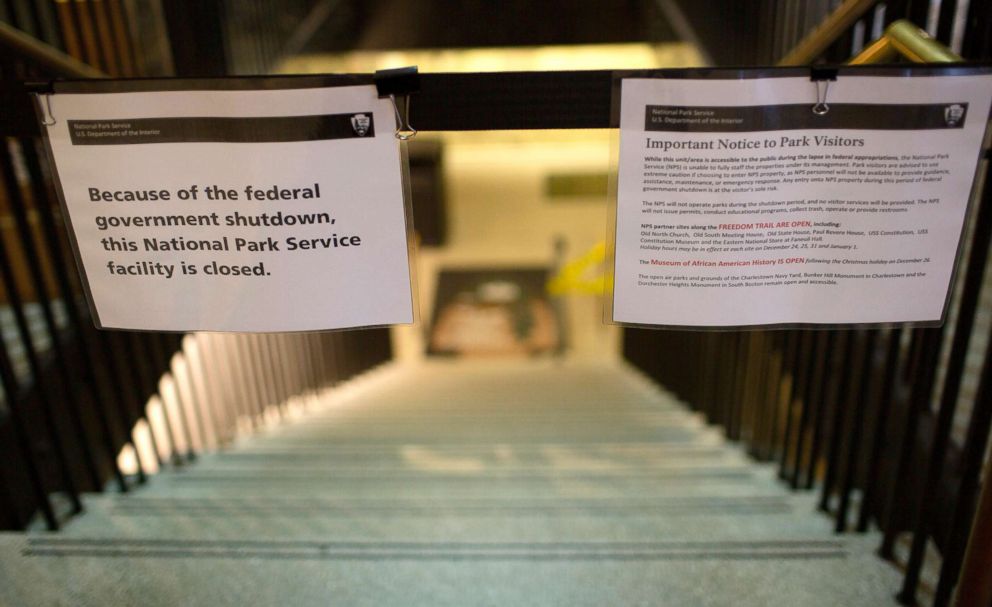 PHOTO: A sign announces the closure of the U.S. Parks Department Information Booth and Visitor Center because of the federal government shutdown, at Faneuil Hall in Boston, Dec. 24, 2018.