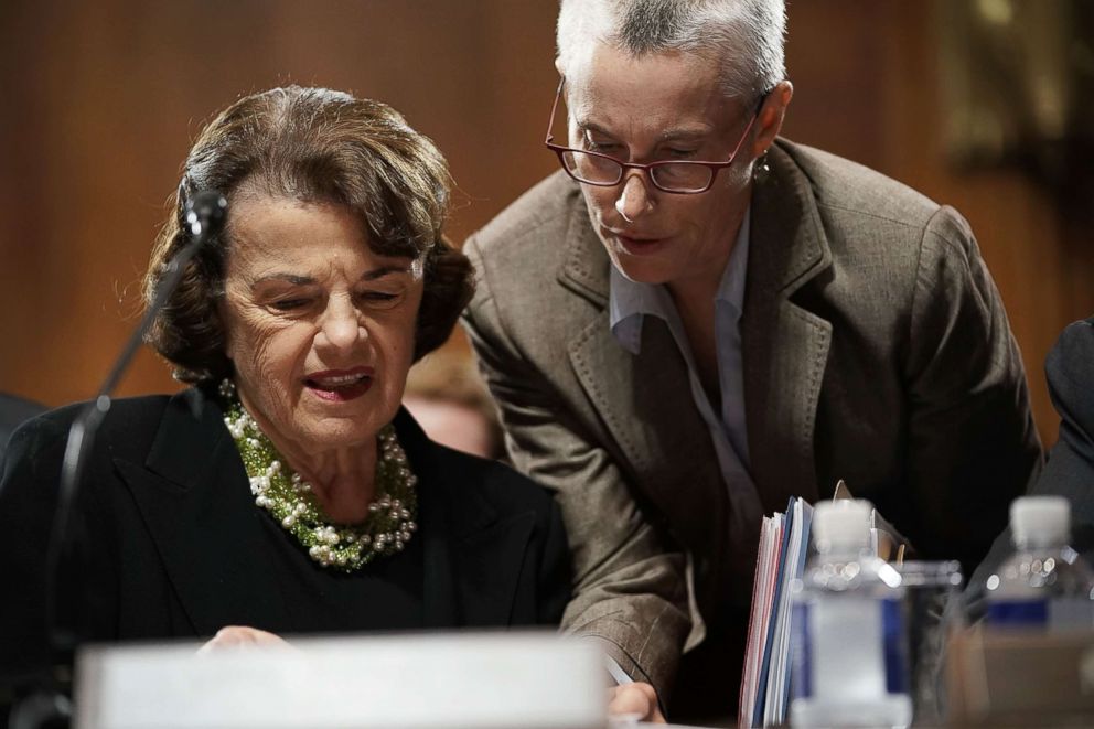 PHOTO: Sen. Dianne Feinstein listens to an aide during a markup hearing before the Senate Judiciary Committee, Sept. 13, 2018, on Capitol Hill.