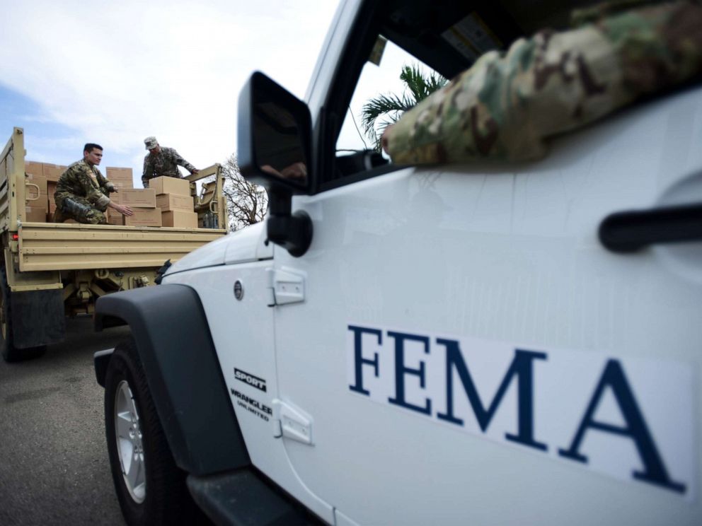PHOTO: In this Oct. 5, 2017 file photo, Department of Homeland Security personnel deliver supplies to Santa Ana community residents in the aftermath of Hurricane Maria in Guayama, Puerto Rico.