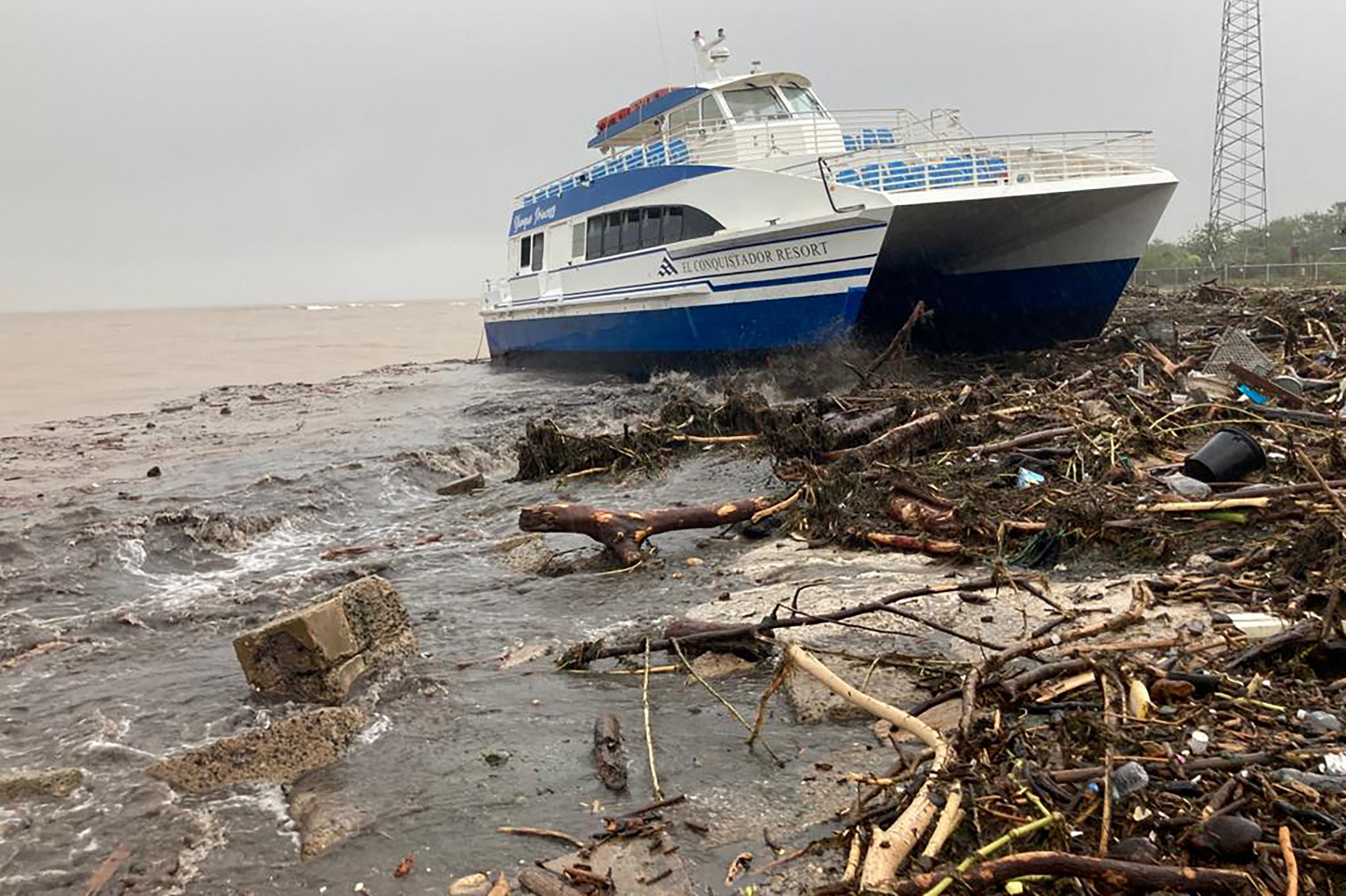 PHOTO: A boat lies washed up on shore after the passing of Hurricane Fiona in Ponce, Puerto Rico September 19, 2022.
