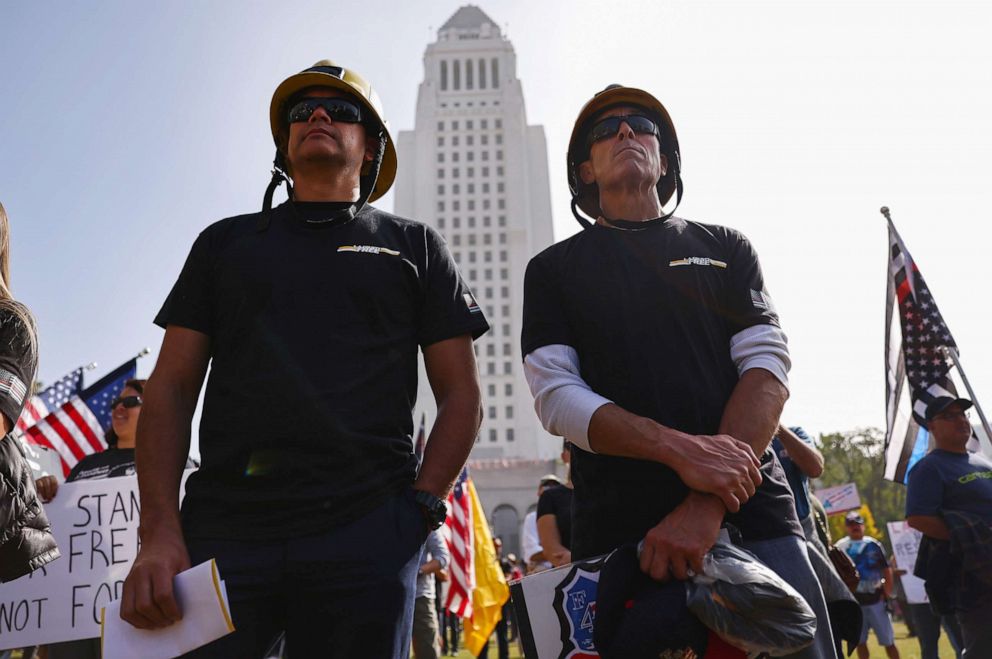 PHOTO: Los Angeles County firefighters stand in Grand Park at a "March for Freedom" rally, demonstrating against the L.A. City Council's COVID-19 vaccine mandate for city employees and contractors, Nov. 8, 2021.