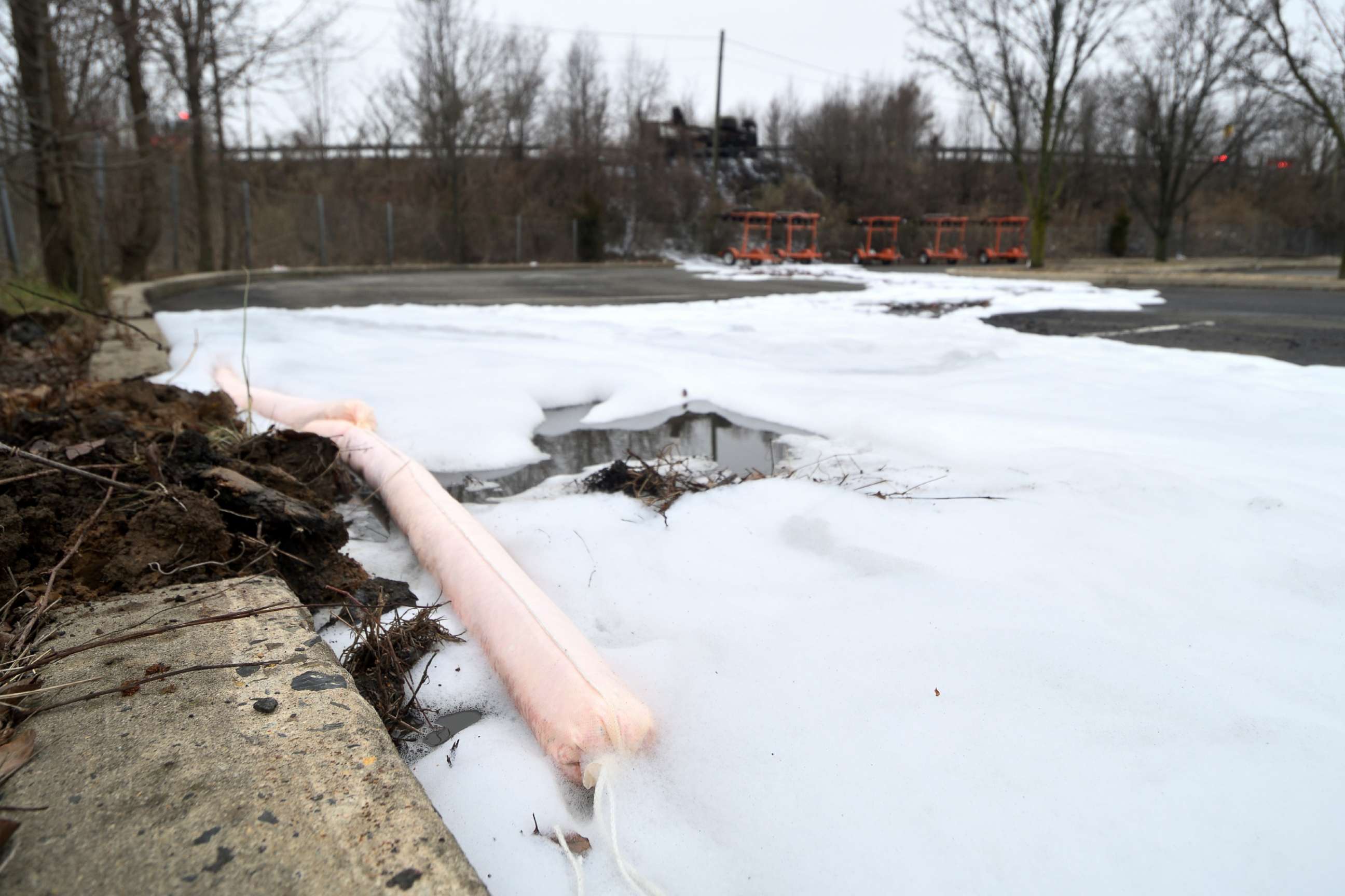 PHOTO: Absorbent booms are used to contain aqueous film forming foams (AFFF) from spilling into the surface water near a scene of a Class B fire of a tanker truck at an off ramp of the Interstate I-95, in Bensalem Township, Penn., Feb. 7, 2019.