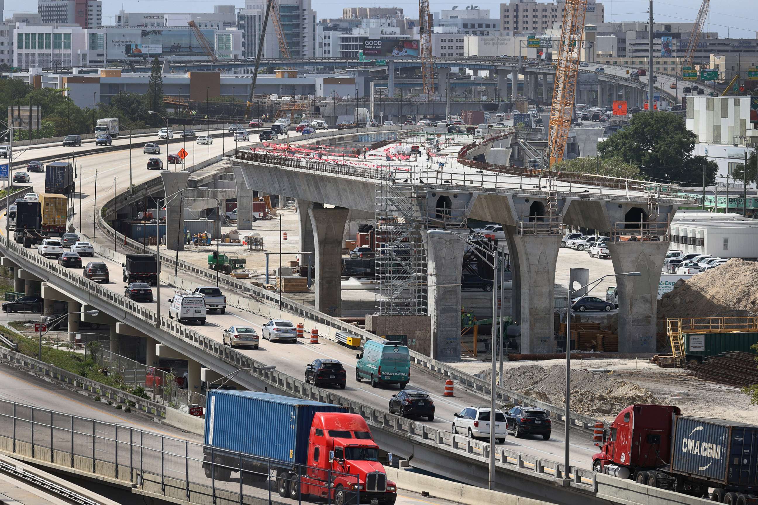 PHOTO: Construction workers build the Signature Bridge, replacing and improving a busy intersection at I-95 and I-395 on March 17, 2021 in Miami. The infrastructure project will ease traffic congestion and connect communities with downtown neighborhoods.