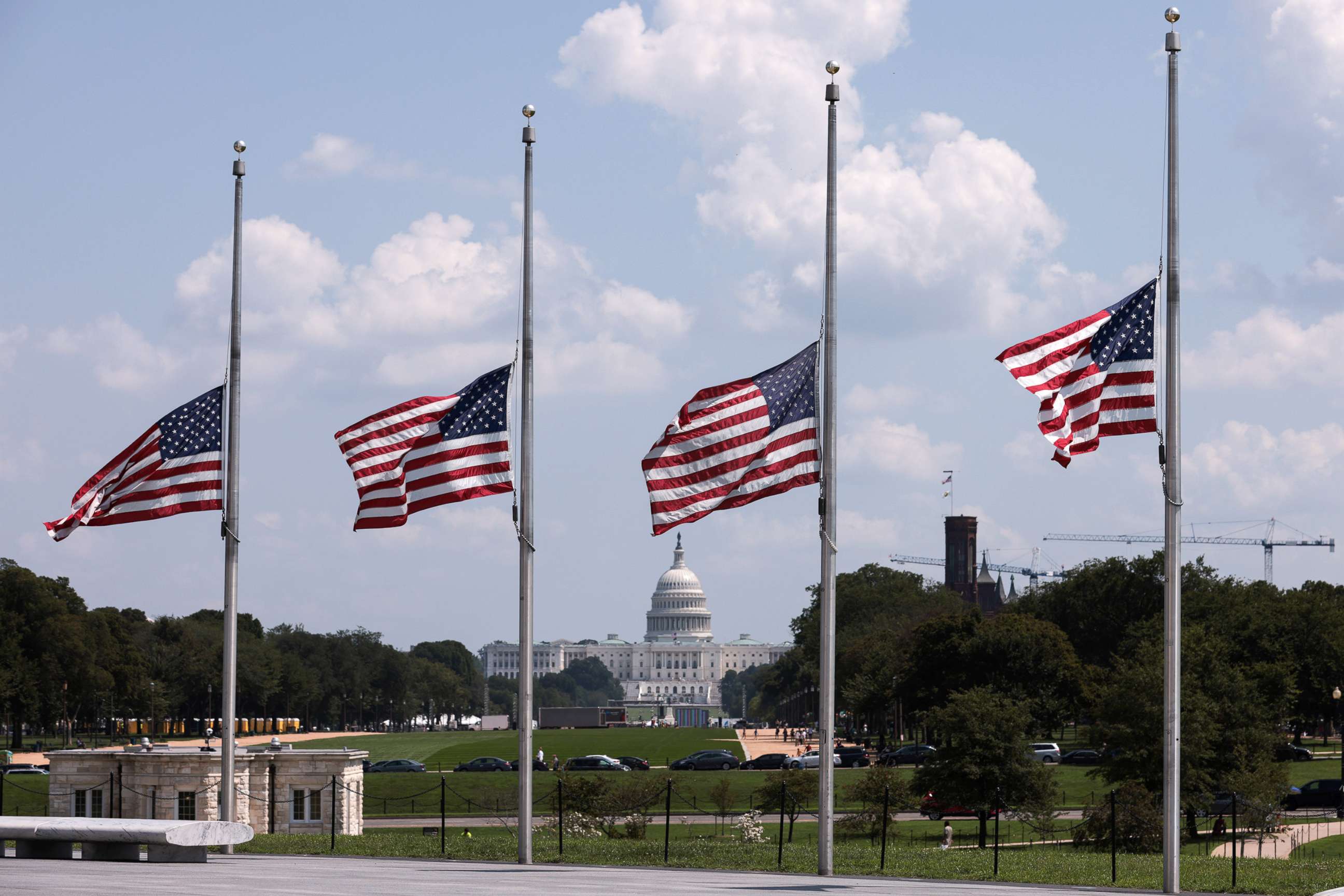 PHOTO: Flags encircling the Washington Monument fly at half staff a day after the death of U.S. service members in an attack in Kabul, Afghanistan, Aug. 27, 2021, in Washington, D.C.