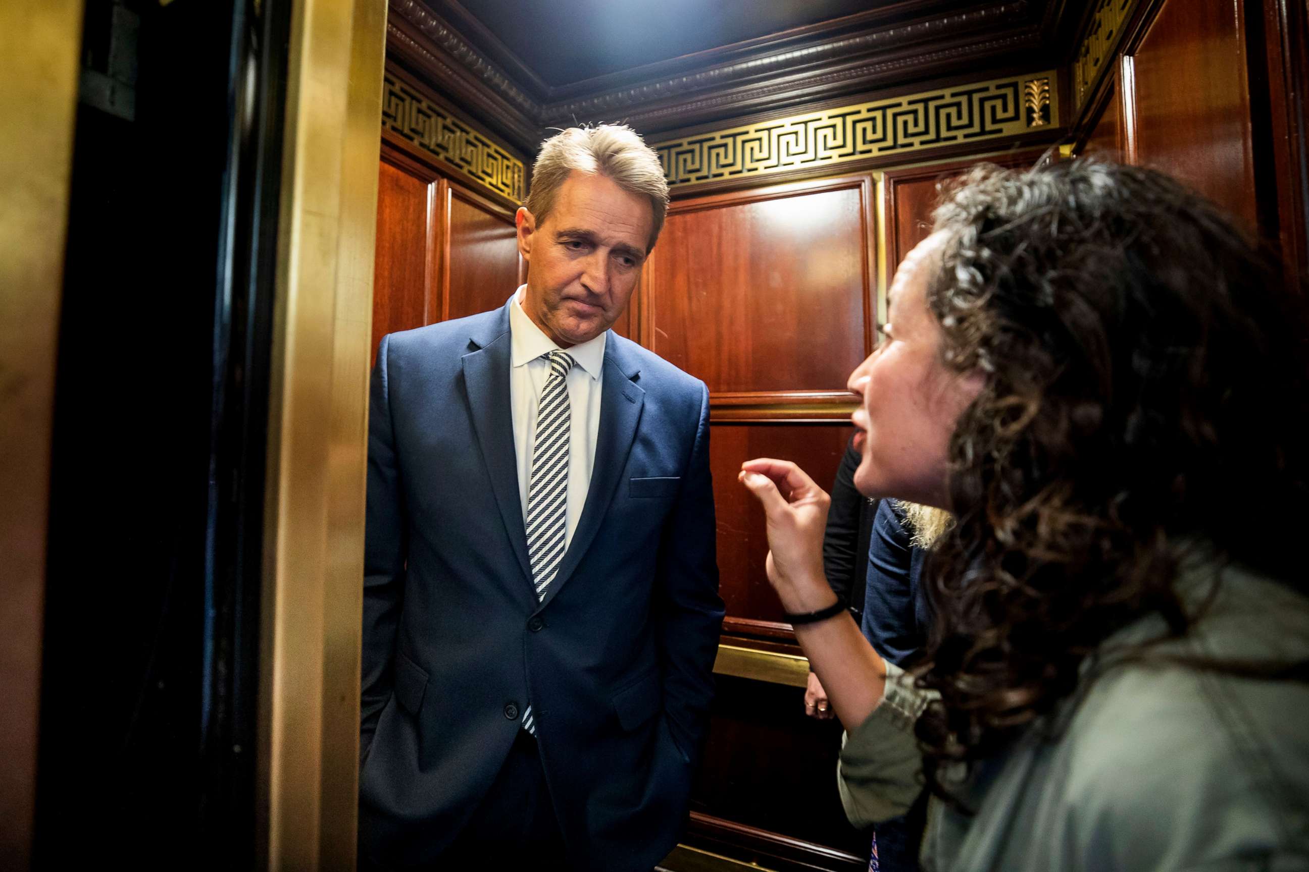 PHOTO: Ana Maria Archila confronts Senator Jeff Flake in an elevator in Washington ahead of a Senate Judiciary Committee meeting on the Supreme Court nomination of Brett Kavanaugh, Sept. 28, 2018.