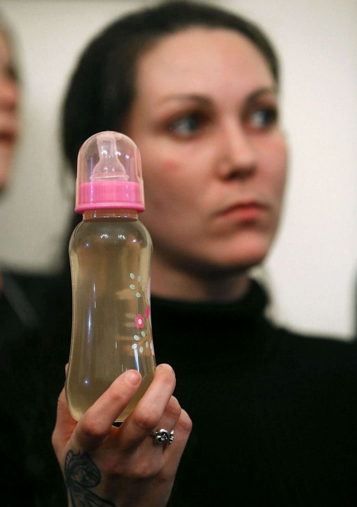 PHOTO: Jessica Owens holds a baby bottle full of contaminated water, during a news conference after attending a House Oversight and Government Reform Committee hearing on the Flint, Michigan water crisis on Capitol Hill, Feb. 3, 2016, in Washington.