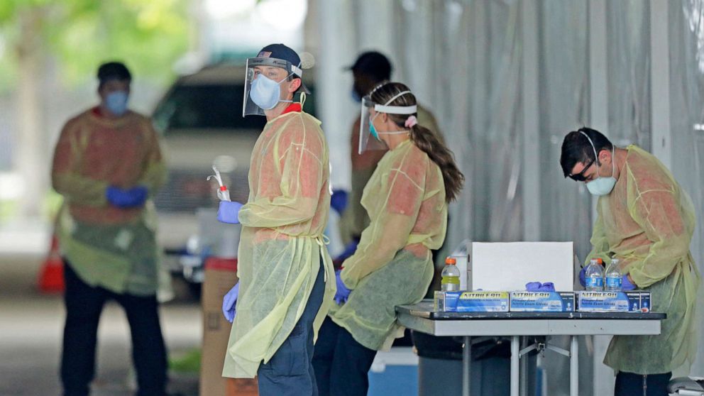 PHOTO: American Medical Response health workers at the COVID-19 drive-through testing center at Holiday Park in Fort Lauderdale as the coronavirus pandemic continues on Thursday, April 30, 2020.
