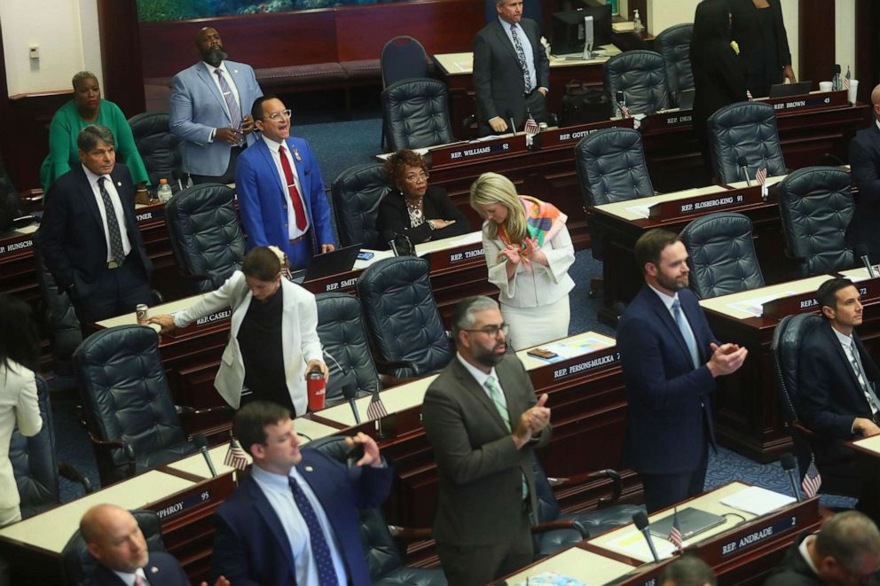 PHOTO: Rep. Carlos Guillermo Smith yells his objection as Republicans in the House of Representatives applaud after Senate Bill 4C Independent Special Districts passes, April 21, 2022, at the Capitol in Tallahassee, Fla. 