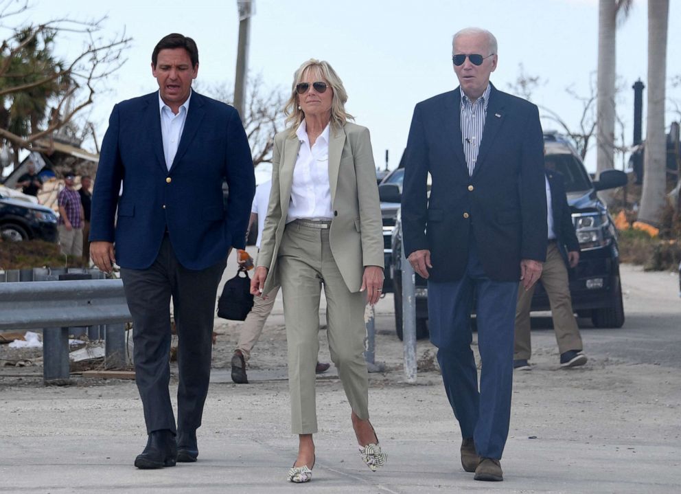 PHOTO: Florida Governor Ron DeSantis, First Lady Jill Biden, and President Joe Biden walk to meet with local residents impacted by Hurricane Ian at Fishermans Pass in Fort Myers, Fla., Oct. 5, 2022.