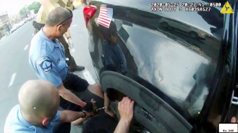 PHOTO: In this image from police body camera video shown as evidence in court, paramedics arrive as Minneapolis police officers, including Derick Chauvin, second from left, and J. Alexander Kueng restrain George Floyd in Minneapolis on May 25, 2020.