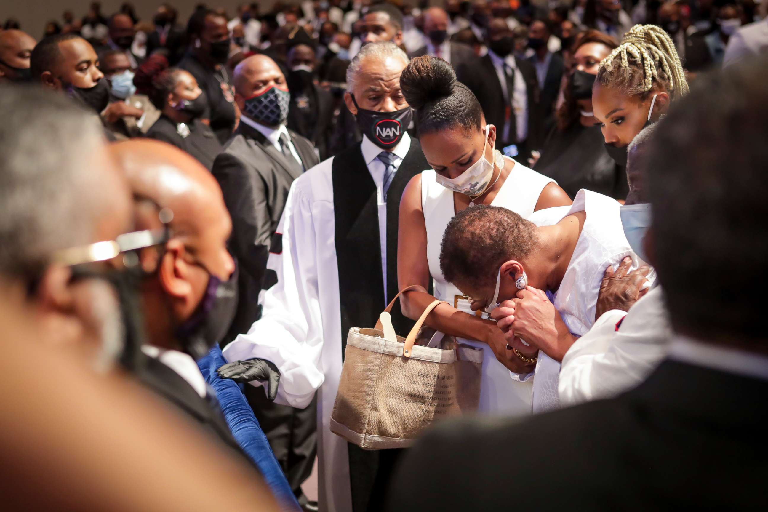 PHOTO: Mourners react as they look at the casket as the extended family processes into the private funeral for George Floyd at The Fountain of Praise church on June 9, 2020 in Houston, Texas.