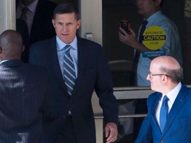 PHOTO: Gen. Michael Flynn, center, with his attorney, Robert Kelner, right, leaves Federal Court in Washington, DC, December 1, 2017 after pleading guilty to one count of lying to the FBI about his back-channel negotiations with the Russian ambassador.