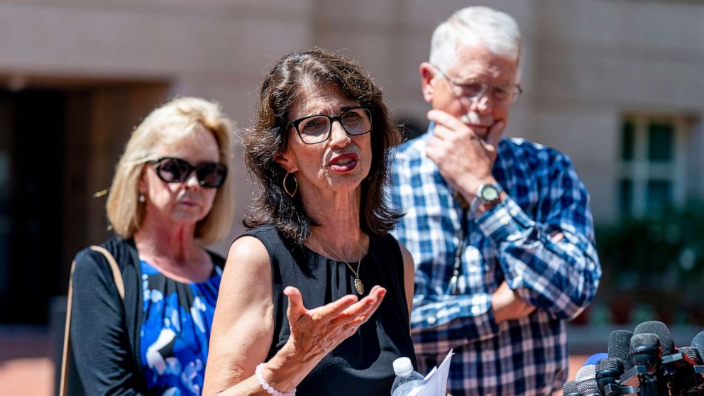 PHOTO: Diane Foley, the mother of James Foley, center, accompanied by Carl and Marsha Mueller, the parents of Kayla Mueller, speaks after the sentencing of El Shafee Elsheikh at the  District Courthouse in Alexandria, Va., Aug. 19, 2022.