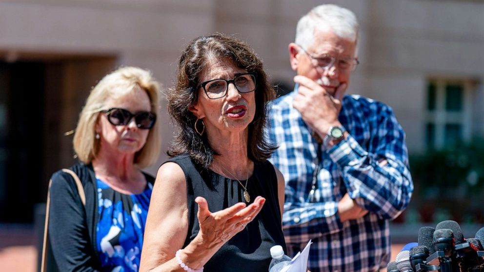 PHOTO: Diane Foley, the mother of James Foley, center, accompanied by Carl and Marsha Mueller, the parents of Kayla Mueller, speaks after the sentencing of El Shafee Elsheikh at the District Courthouse in Alexandria, Va., Aug. 19, 2022.