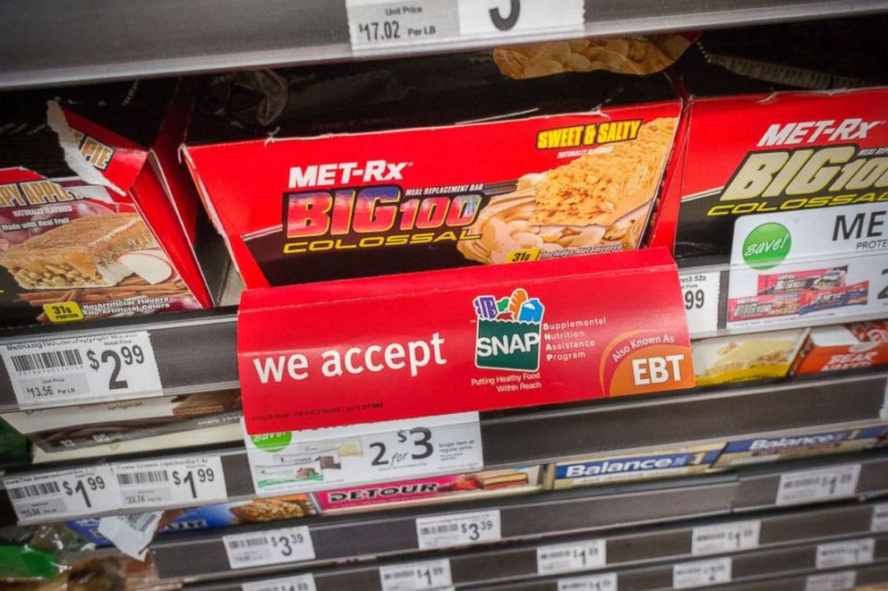 PHOTO: A sign on a sales rack of an energy bar in a 7-Eleven in New York on July 27, 2014 promotes the convenience store's acceptance of the SNAP (Supplemental Nutrition Assistance Program) formerly known as EBT.