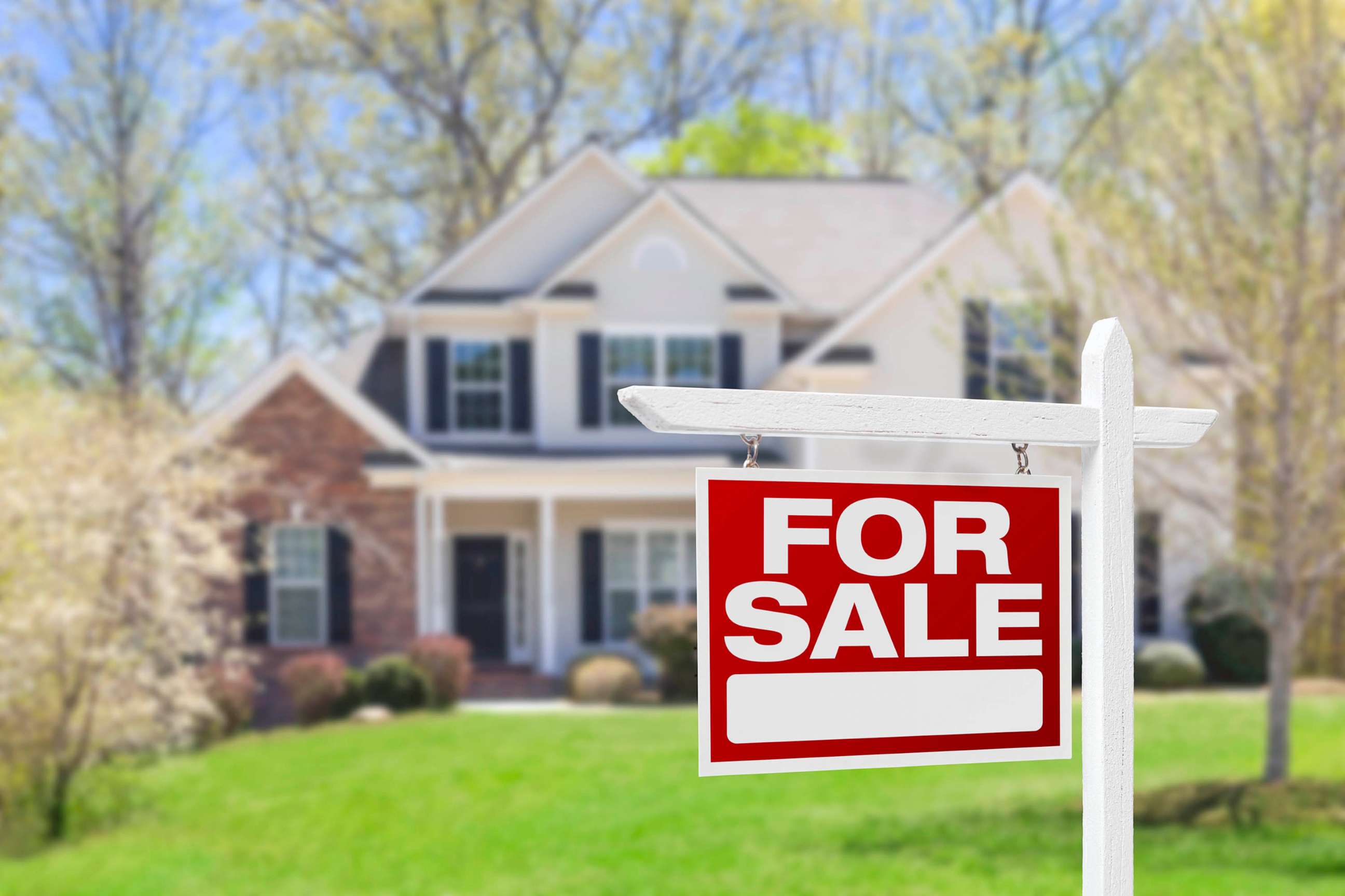 STOCK PHOTO: In this undated stock photo, a "For Sale" sign stands in front of a house.