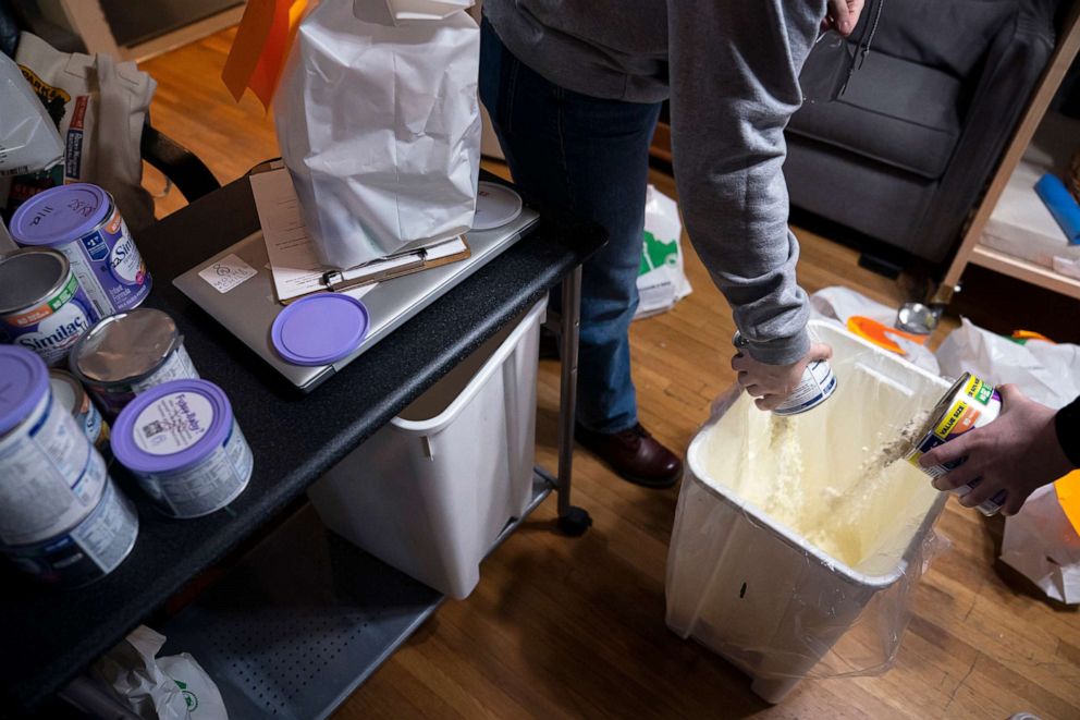 PHOTO: Staff at the Mother & Child Education Center, throw away recalled Similac baby formula, which the company would not replace or reimburse because the donated supplies did not come with a receipt, May 12, 2022, in Portland, Oregon.