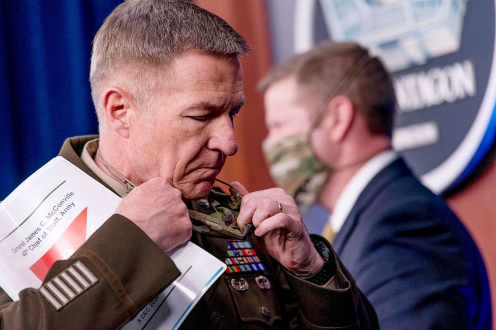 PHOTO: Gen. James McConville, Chief of Staff of the Army, left, steps away from the podium as Secretary of the Army Ryan McCarthy, right, prepares to speak at a briefing on an investigation into Fort Hood, Texas at the Pentagon,  Dec. 8, 2020.