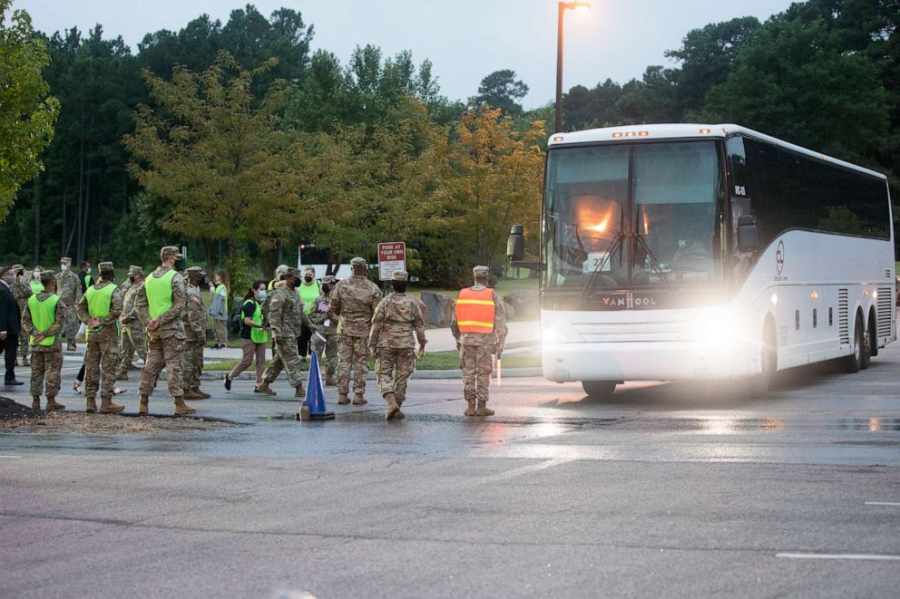 PHOTO: Members of the Department of State, Department of Defense, and Non-Governmental Organizations work together to welcome Afghan Special Immigrant Visa applicants, Aug. 7, 2021, at Fort Lee, Va.