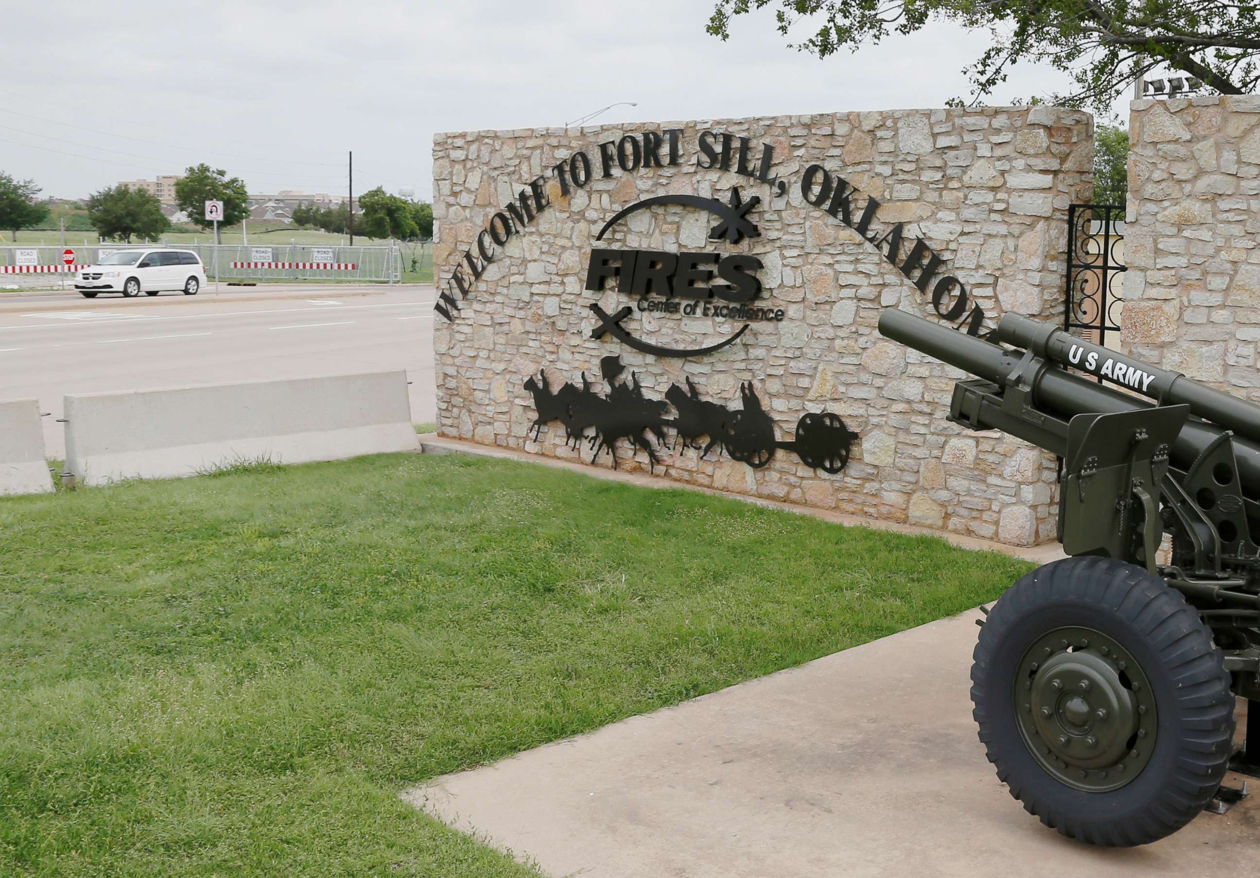 PHOTO: A vehicle drives by a sign at Scott Gate, one of the entrances to Fort Sill, in Fort Sill, Okla., in this June 17, 2014 file photo.