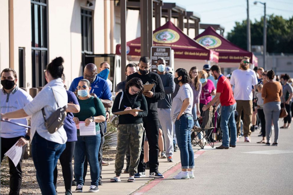 PHOTO: people wait in line to vote at Tarrant County Elections Center on the last day of early voting in Fort Worth, Texas, Oct. 29, 2020.