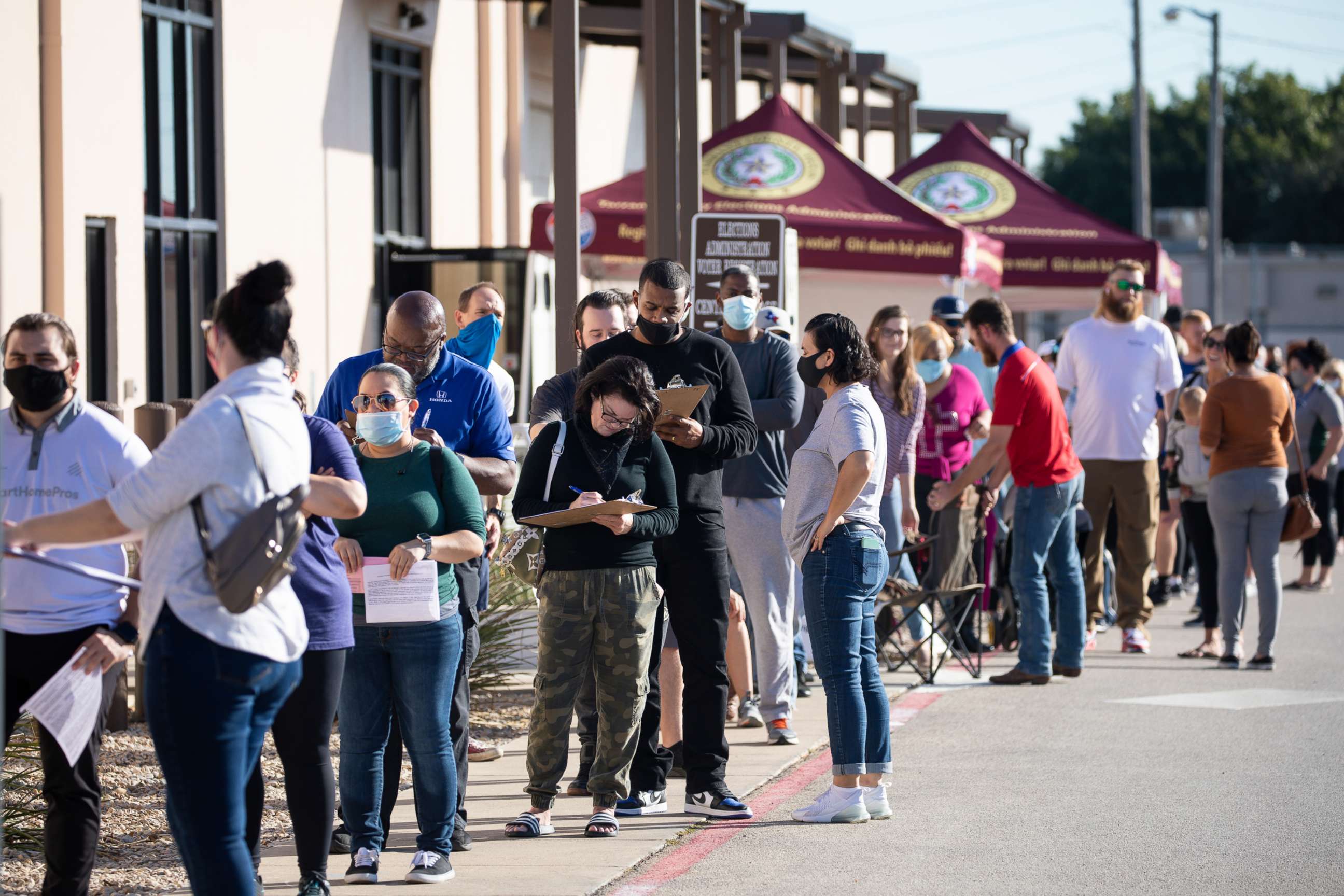 PHOTO: In this Oct. 29, 2020, file photo, people wait in line to vote at Tarrant County Elections Center on the last day of early voting in Fort Worth, Texas.