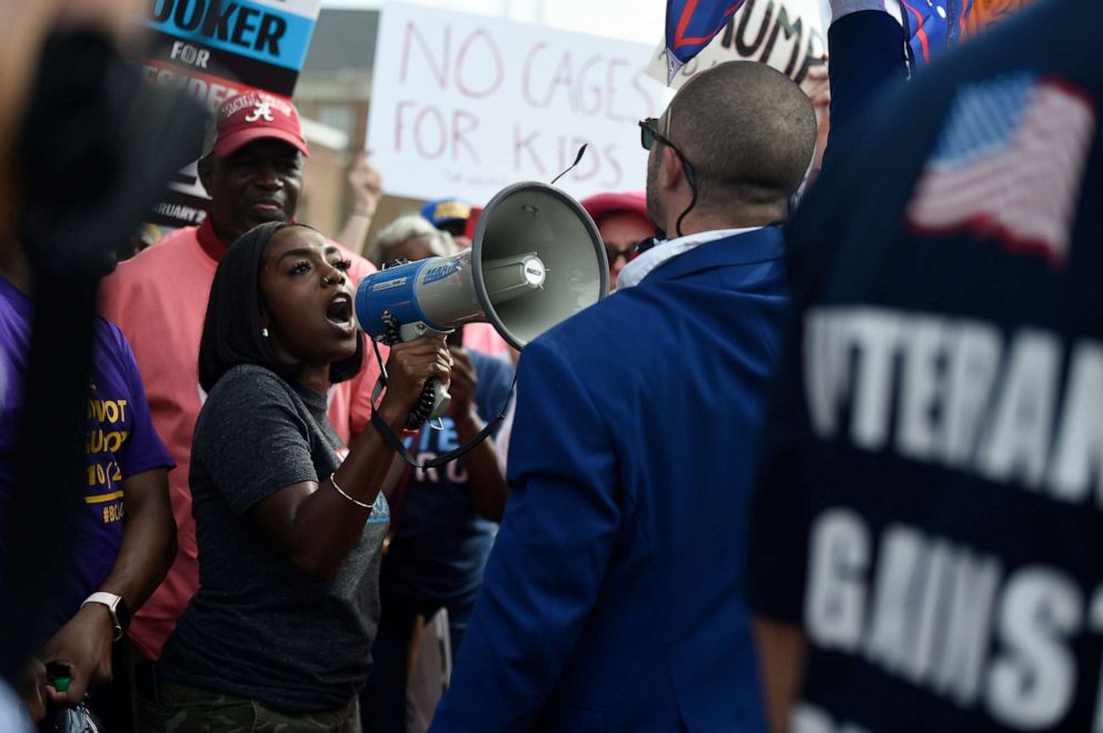PHOTO: A supporter of President Donald Trump, right, clashes with an anti-Trump protester, left, outside the president's appearance at a criminal justice forum on Friday, Oct. 25, 2019, in Columbia, S.C.
