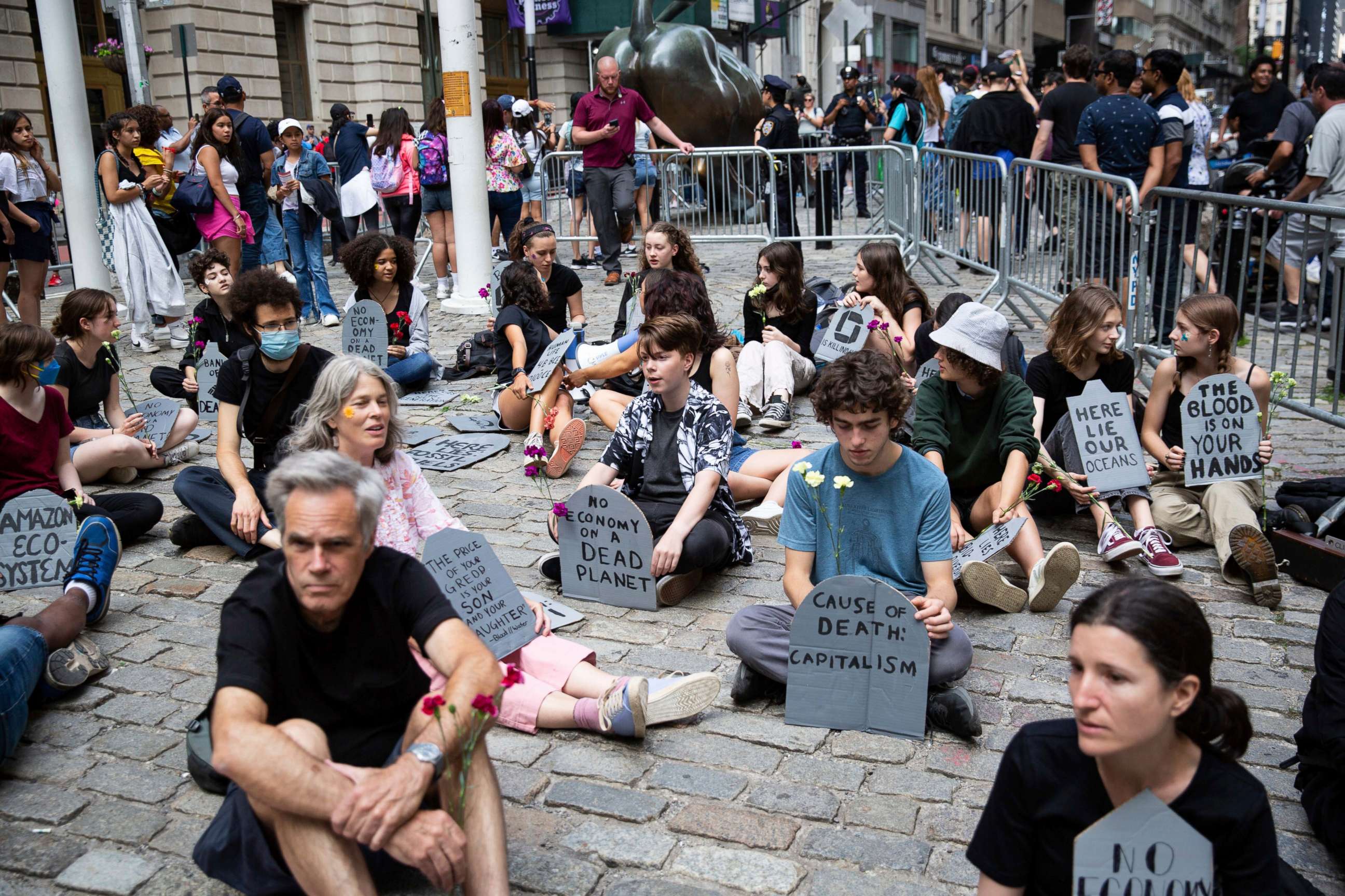 PHOTO: Fridays for Future New York City (FFF NYC) activists participated in a climate die-in at Bowling Green Park, New York City on June 10, 2022 calling on major banks and asset managers to take concrete steps to divest from fossil fuels.