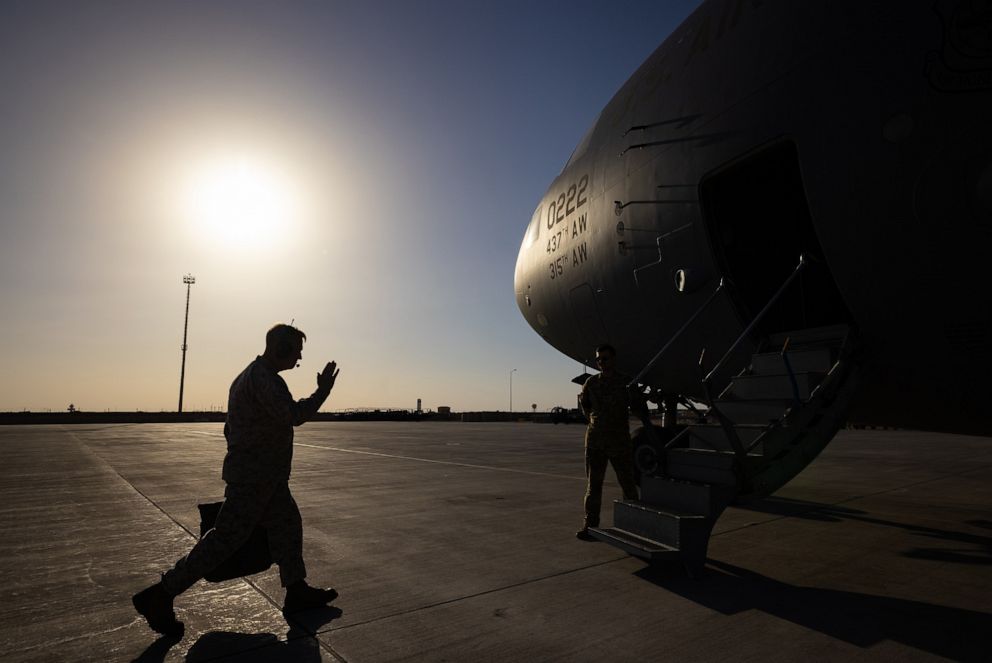 PHOTO: Commander of U.S. Central Command, Gen. Frank McKenzie, prepares to board a C-17 cargo plane at Al Asad Airbase in Iraq.