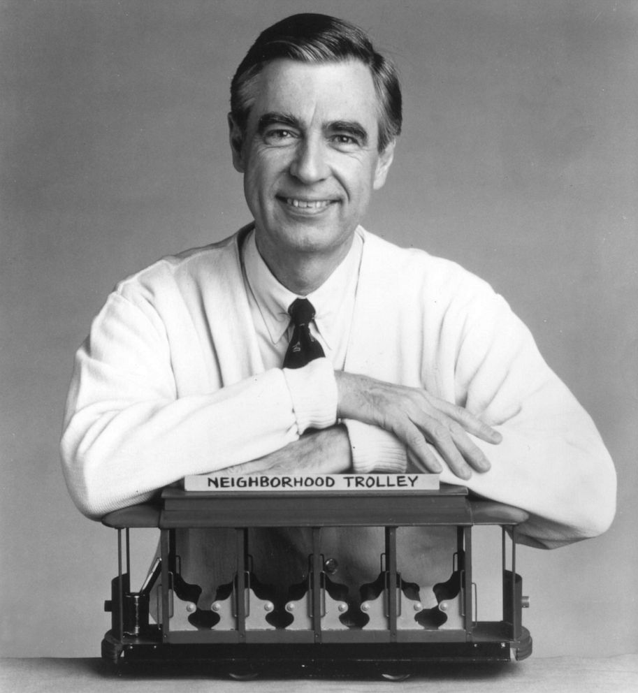 PHOTO: Fred Rogers, the host of the children's television series, "Mr. Rogers' Neighborhood," rests his arms on a small trolley in this promotional  portrait from the 1980's.