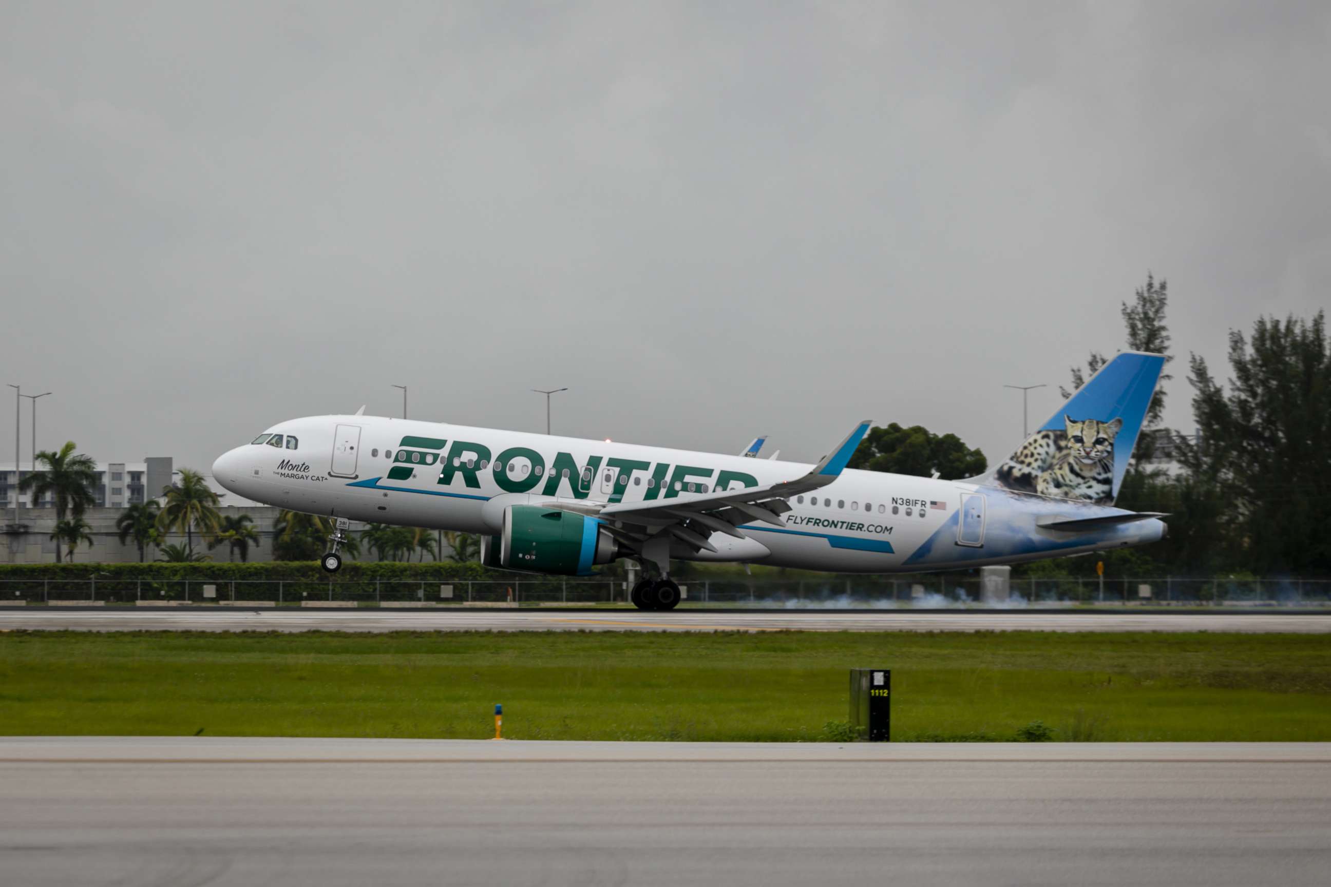 PHOTO: A passenger aircraft operated by Frontier Airlines Inc. lands at Miami International Airport in Miami, Florida, June 16, 2021.