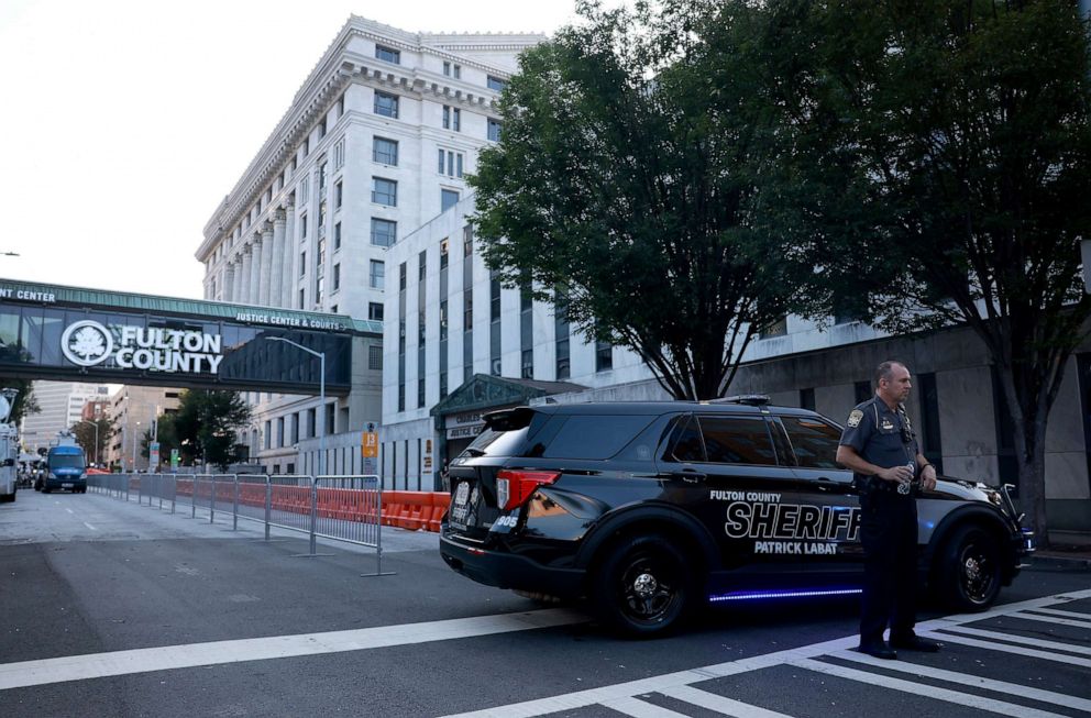 PHOTO: A Fulton County Sheriff officer blocks off a street in front of the Fulton County Courthouse on Aug. 14, 2023, in Atlanta.