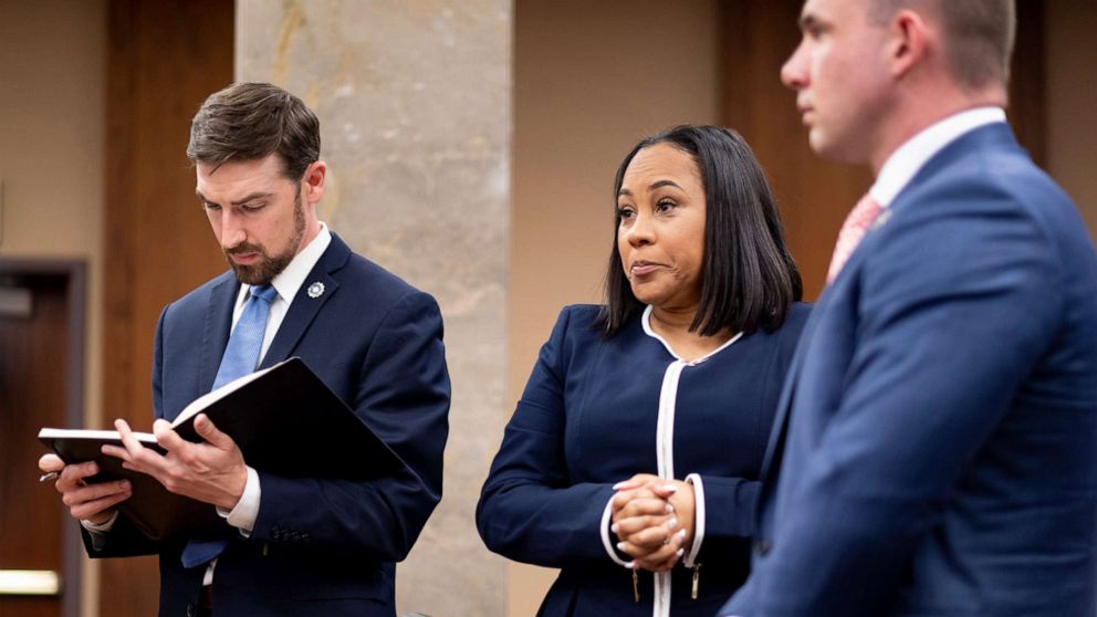 PHOTO: Fulton County District Attorney Fani Willis, center, and members of her team watch as potential jurors are excused during proceedings to seat a special purpose grand jury in Fulton County, Ga., May 2, 2022.