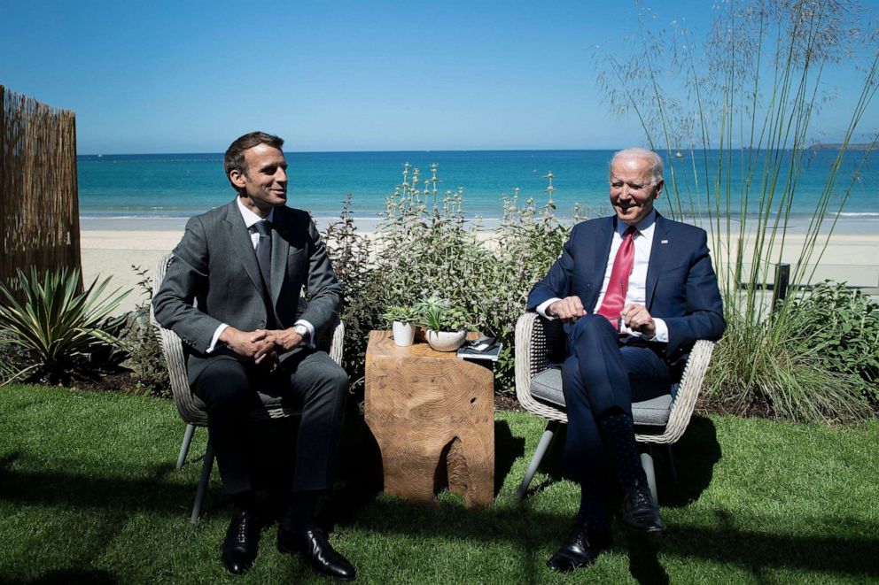 PHOTO: France's President Emmanuel Macron and US President Joe Biden chat before a bilateral meeting during the G7 summit in Carbis bay, Cornwall on June 12, 2021.