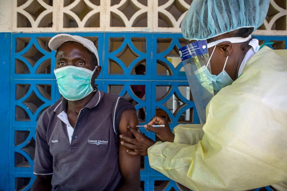 PHOTO:A health worker administers w vaccine to a nurse at Chirau Village Clinic in Zvimba Rural District on Feb. 23, 2021 near Chinhoyi, Zimbabwe.