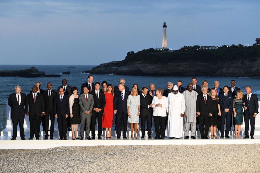 PHOTO: G7 leaders and guests pose for a family picture with the Biarritz lighthouse in the background on the second day of  the annual G7 summit, Aug. 25, 2019, in Biarritz, France. 