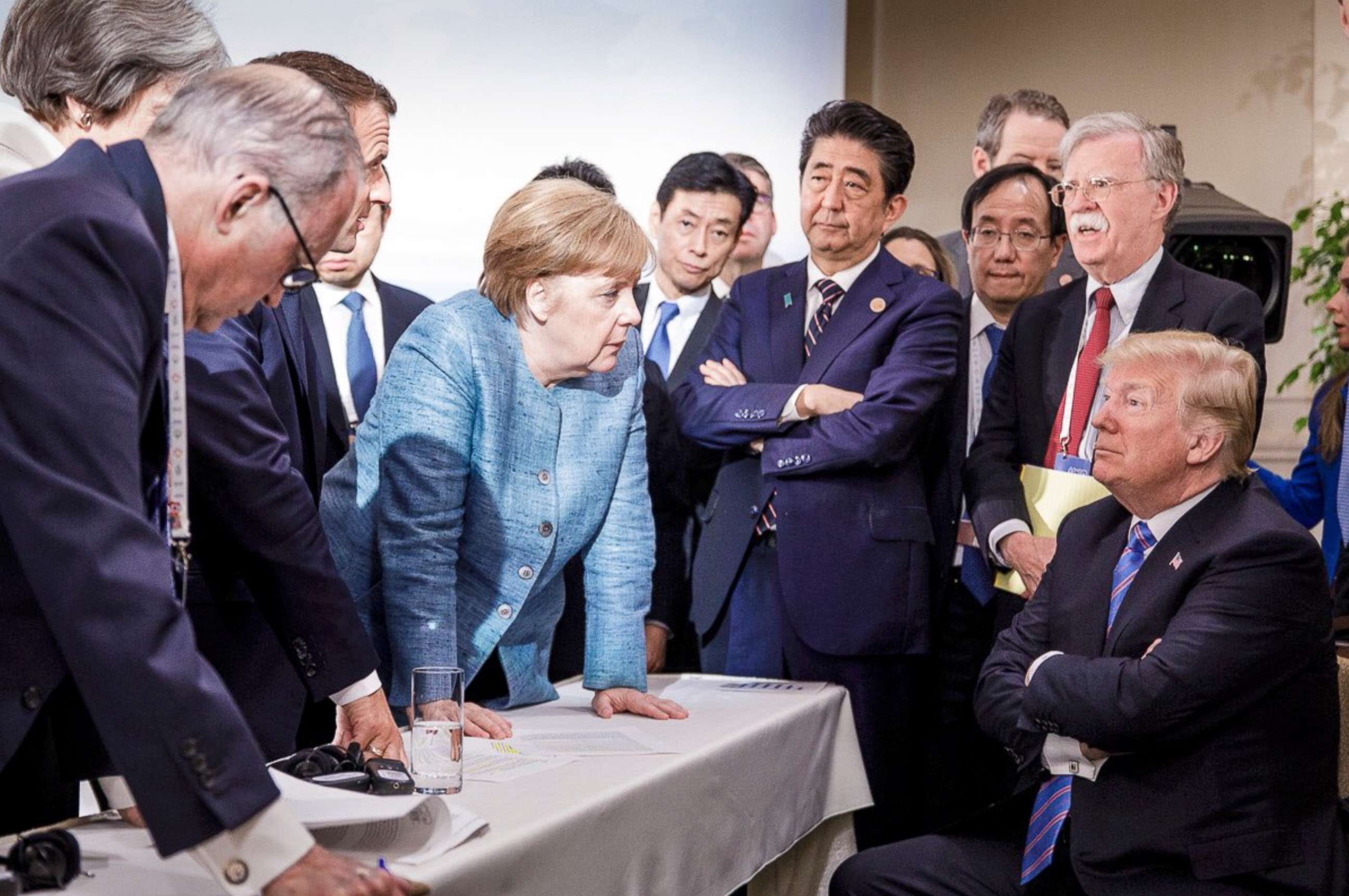 PHOTO: In this photo made available by the German Federal Government, German Chancellor Angela Merkel, center, speaks with U.S. President Donald Trump, seated at right, during the G7 Leaders Summit in La Malbaie, Quebec, Canada, June 9, 2018. 
