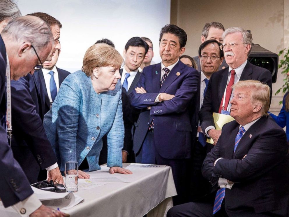 PHOTO: In this photo made available by the German Federal Government, German Chancellor Angela Merkel, center, speaks with U.S. President Donald Trump, seated at right, during the G7 Leaders Summit in La Malbaie, Quebec, Canada, June 9, 2018. 