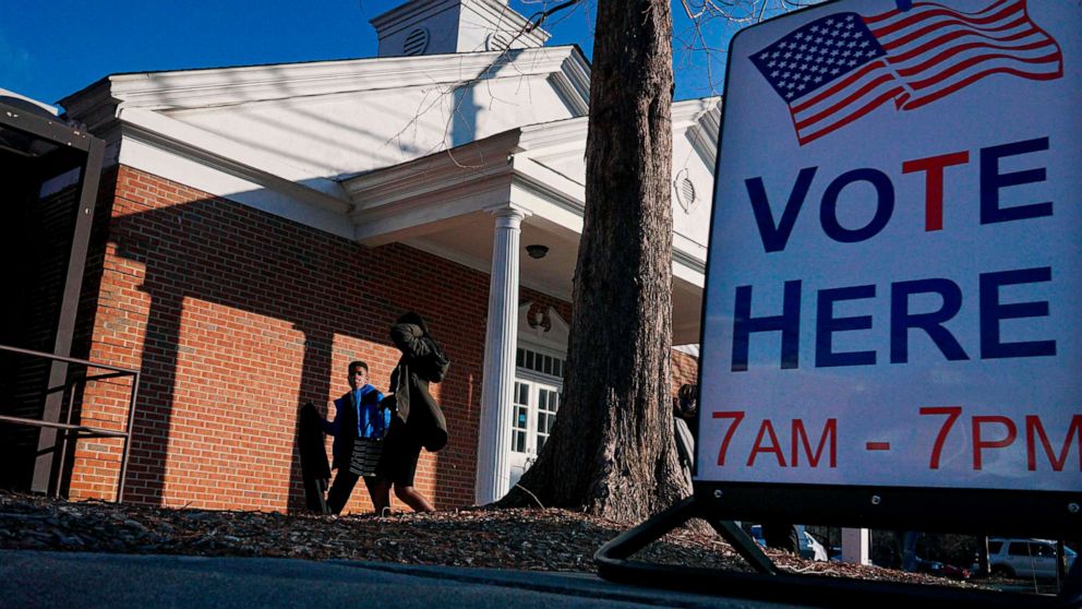 PHOTO: Voters enter a polling station at the Zion Baptist Church, Jan. 5, 2021, in Marietta, Ga.
