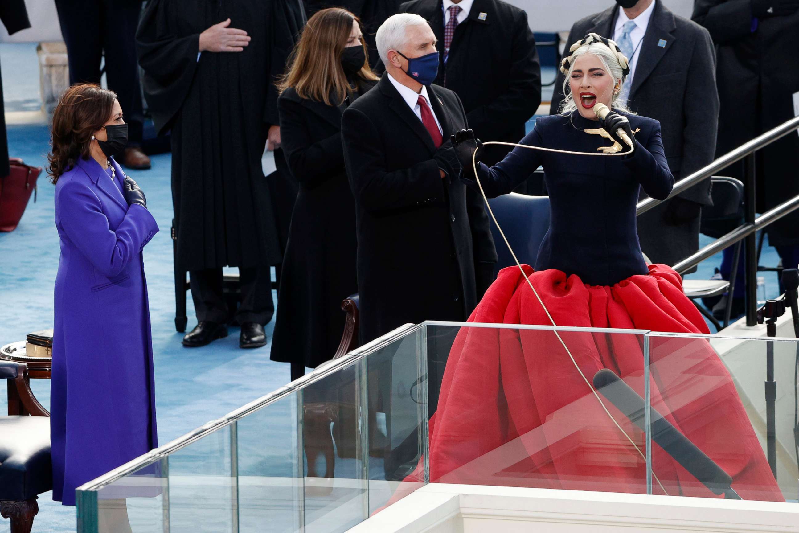 PHOTO: Lady Gaga sings the National Anthem as Vice President Mike Pence and Vice President-elect Kamala Harris listen during the inauguration of Joe Biden on the West Front of the U.S. Capitol in Washington, D.C., Jan. 20, 2021.