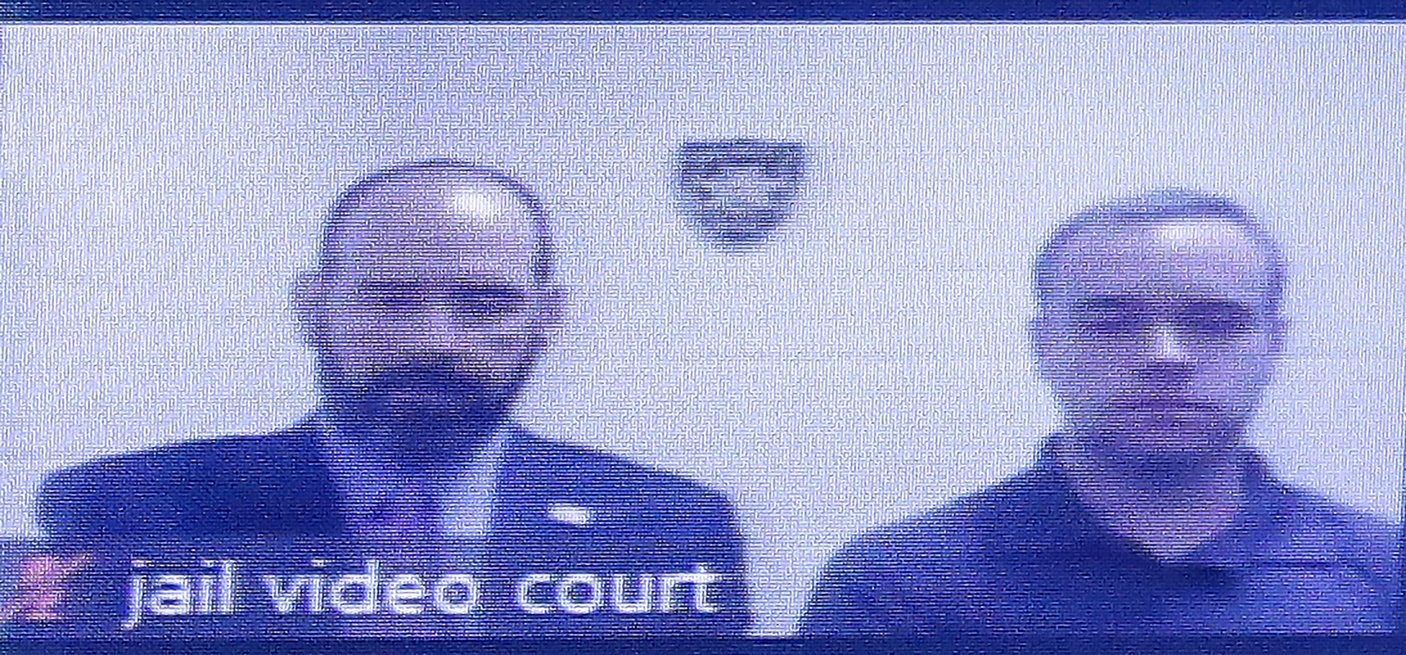 PHOTO: Former Atlanta police Officer Garrett Rolfe, right, appears on a television screen with attorney Lance LoRusso, June 30, 2020, in Atlanta.