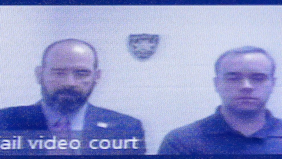 PHOTO: Former Atlanta police Officer Garrett Rolfe, right, appears on a television screen with attorney Lance LoRusso, June 30, 2020, in Atlanta.