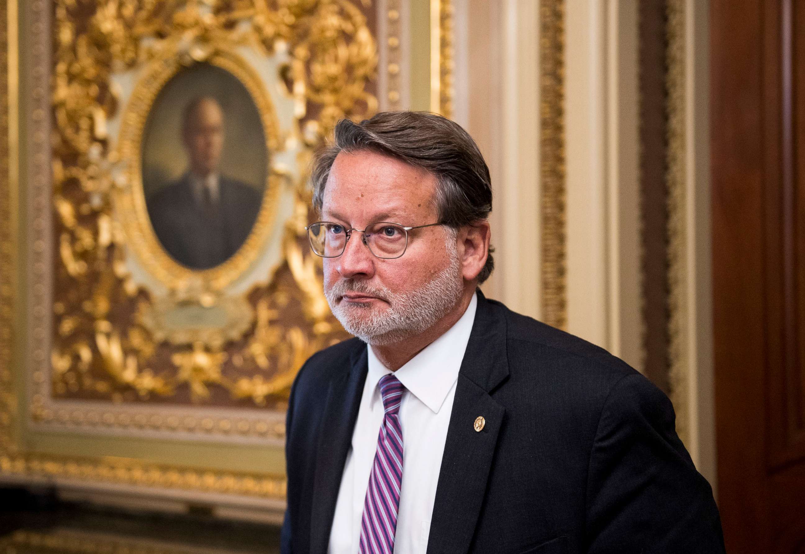 PHOTO: Sen. Gary Peters leaves the Senate Democrats' policy lunch in the Capitol on Sept. 10, 2019.