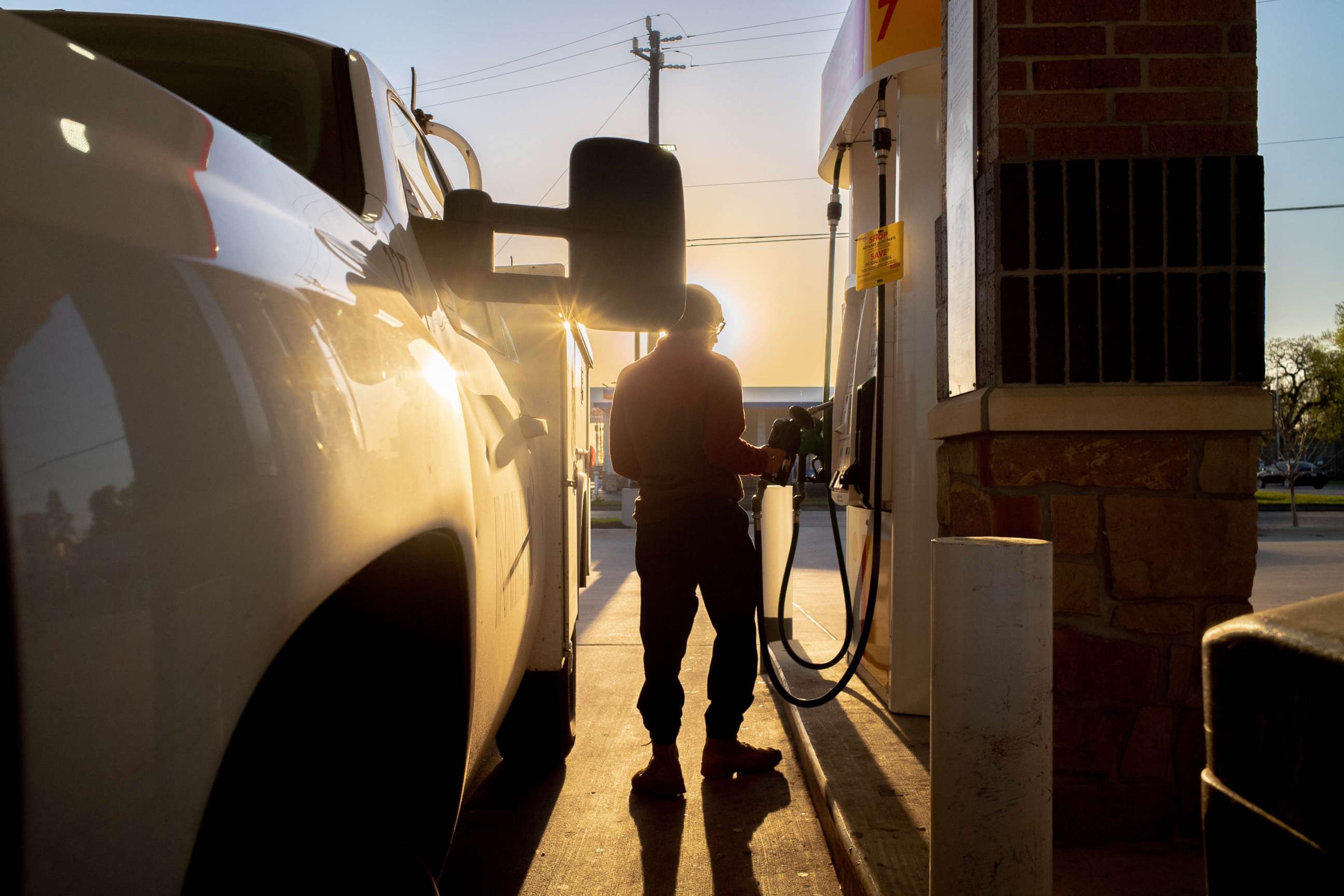 PHOTO: A person prepares to pump gas at a gas station in Houston, April 01, 2022.