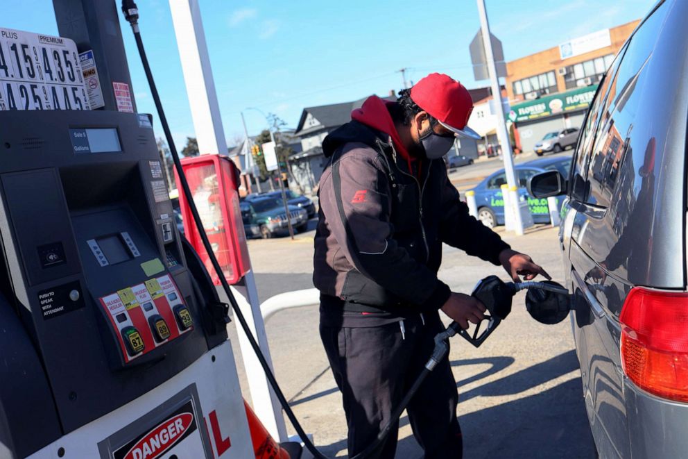PHOTO: A Lukoil gas station attendant pumps gas in a customer's car on March 4, 2022 in Brooklyn, New York.