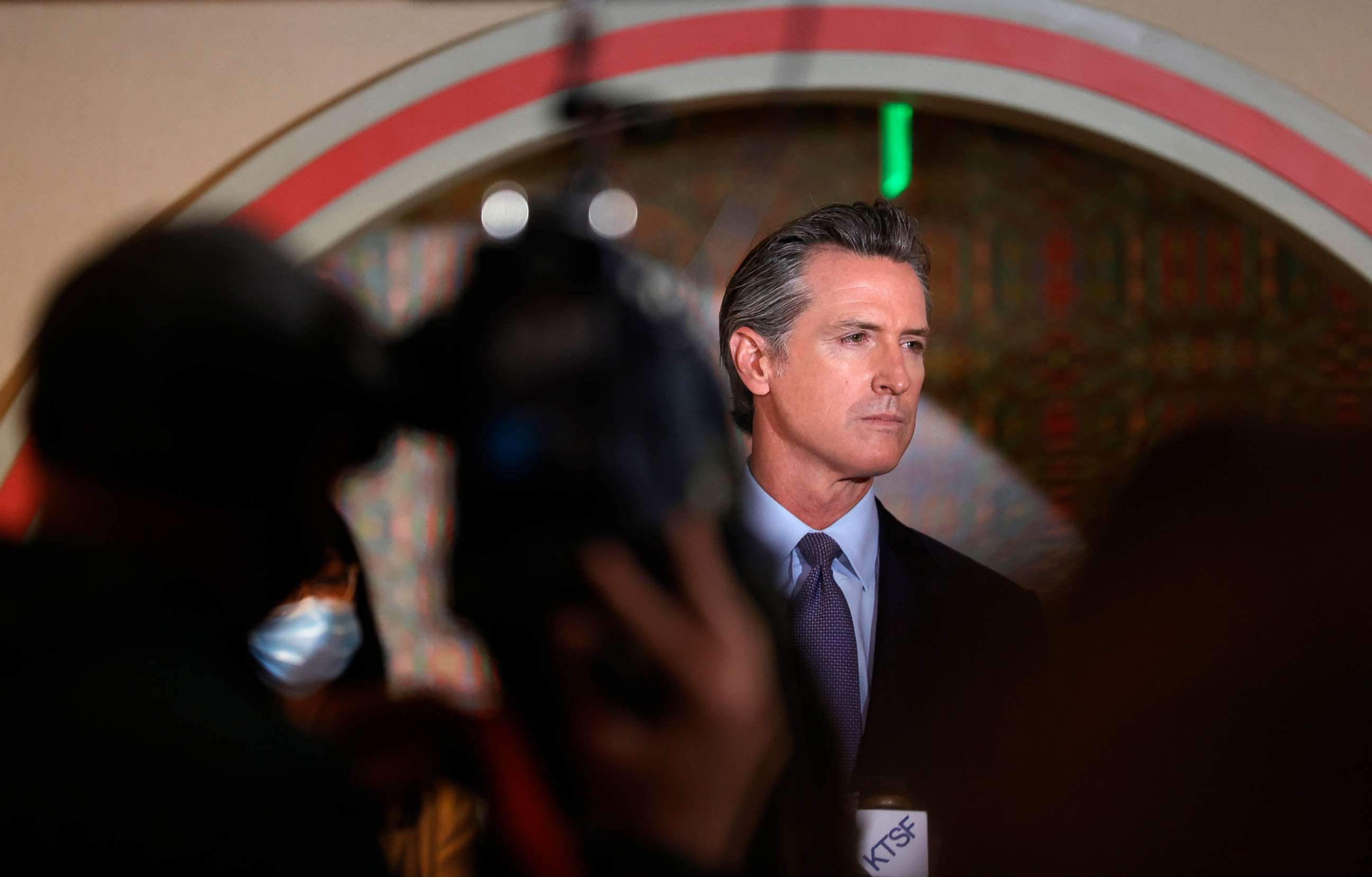 PHOTO: California Gov. Gavin Newsom looks on during a news conference in San Francisco,  March 19, 2021.