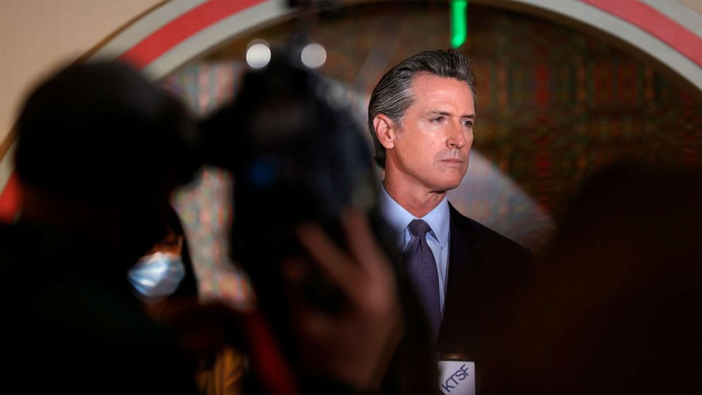 PHOTO: California Gov. Gavin Newsom looks on during a news conference in San Francisco,  March 19, 2021.