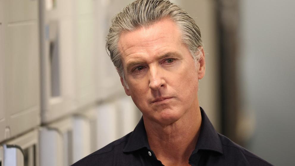 PHOTO: California Governor Gavin Newsom listens before speaking during a press conference announcing $11 insulin and prescription drugs with the CalRX program inside a Cedars-Sinai pharmacy in Los Angeles, October 16, 2025.
