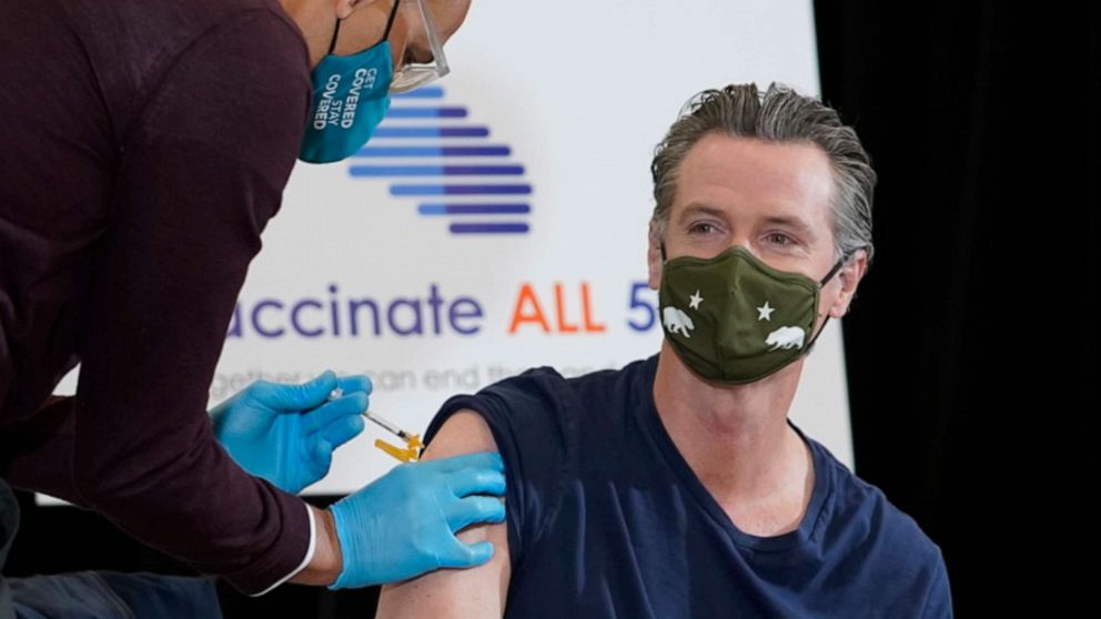 PHOTO: Dr. Mark Ghaly, Secretary, California Health and Human Services, gives California Gov. Gavin Newsom the one-dose Janssen COVID-19 vaccine by Johnson & Johnson at the Baldwin Hills Crenshaw Plaza in LA April 1, 2021.