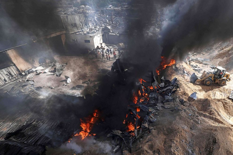 PHOTO: Palestinian firefighters douse a huge fire in the northern Gaza Strip, on May 17, 2021.
